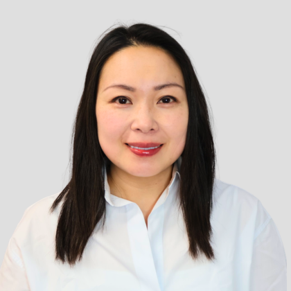 a headshot image of tracy tang dental hygienist in white shirt at optimal dental health