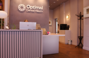 reception and front of house at optimal dental health in london with purple decor and mood lighting for nervous patients